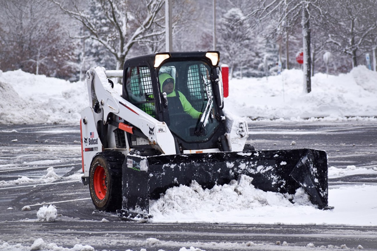 Commercial snow operations clearing an active property